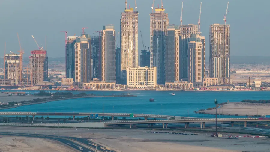 construction of new skyscrapers in dubai creek harbor aerial timelapse