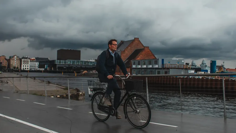 A man riding bicycle on Copenhagen Denmark.