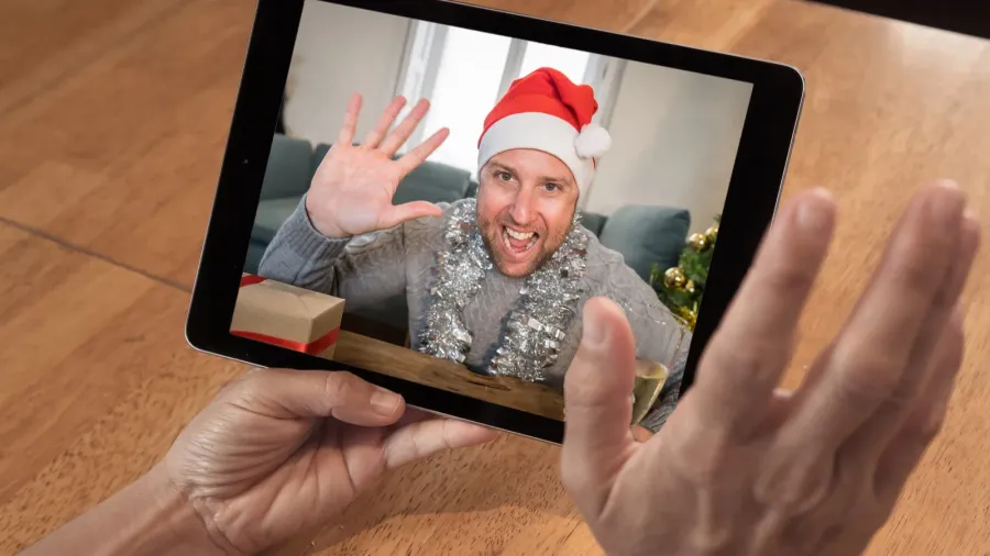 covid19 virtual christmas celebration screen tablet image with man on