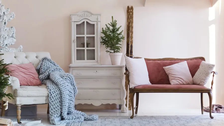 A cozy living room interior of vintage furniture with festive decorated.