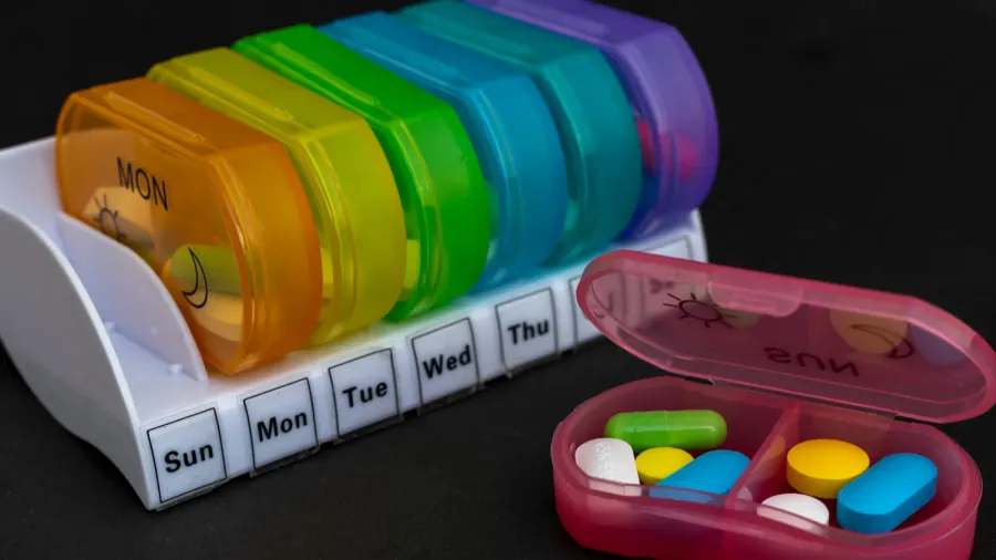 daily drug dose or pills organizer boxes for a complete