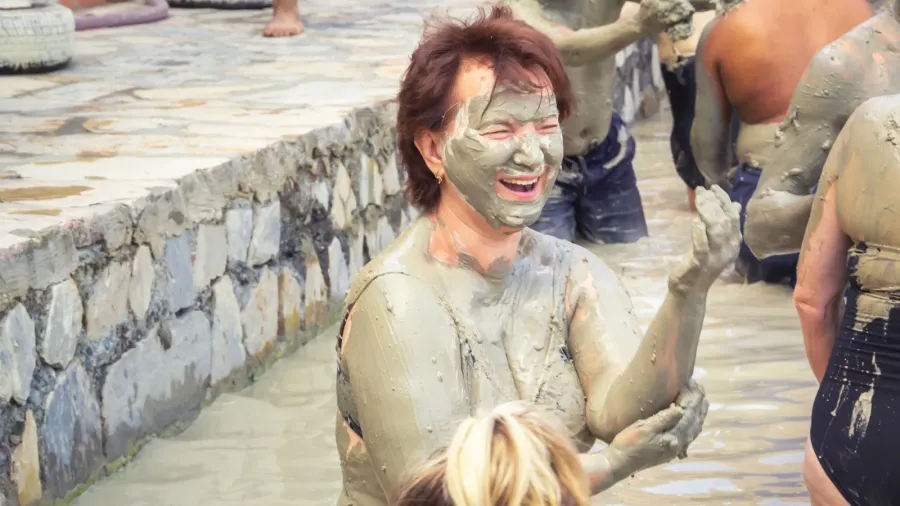 dalyan turkey  may 9 2022 laughing woman smears herself
