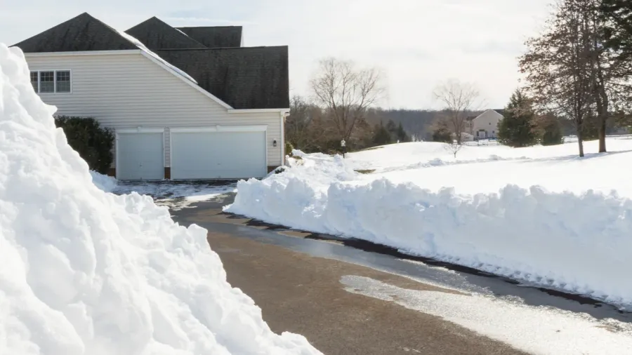 deep drifts by side of driveway to modern home