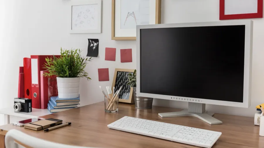 desktop computer on wooden desk