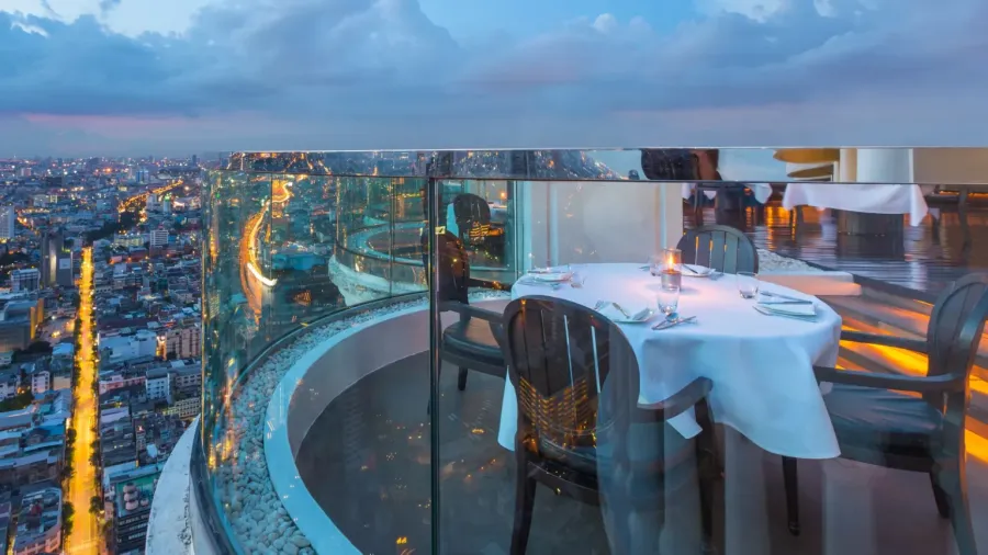 dining table with beautiful city view at twilight scene