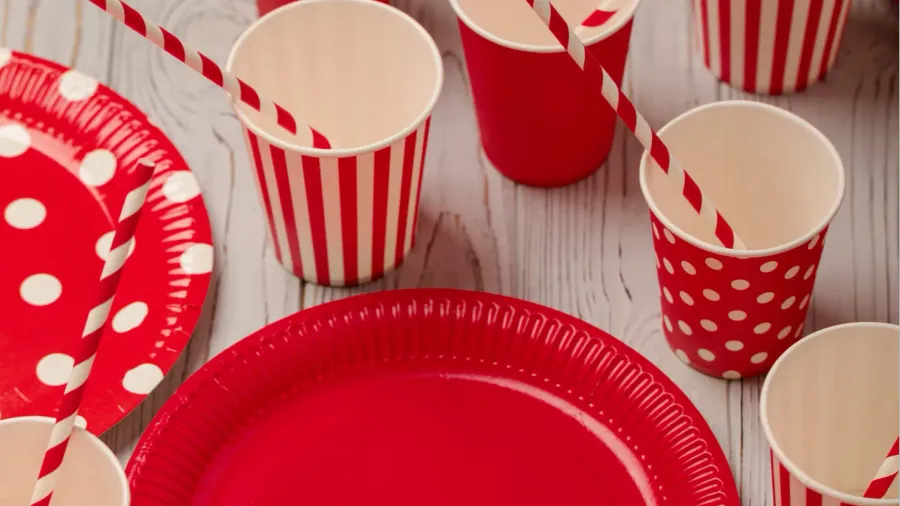 disposable paper utensils of red and white color on a