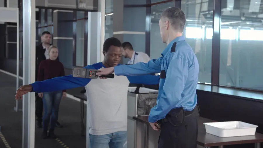 diverse passengers passing security control