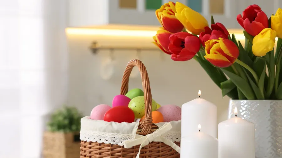 easter decorations bouquet of tulips painted eggs and burning candles
