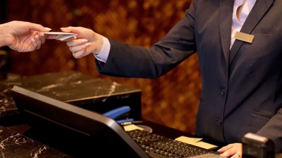 easy transaction woman paying with a credit card at hotel