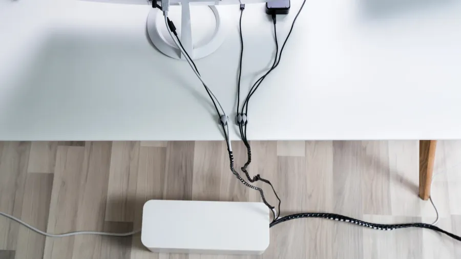 A device with multiple wires, likely a charging or electronic device setup.