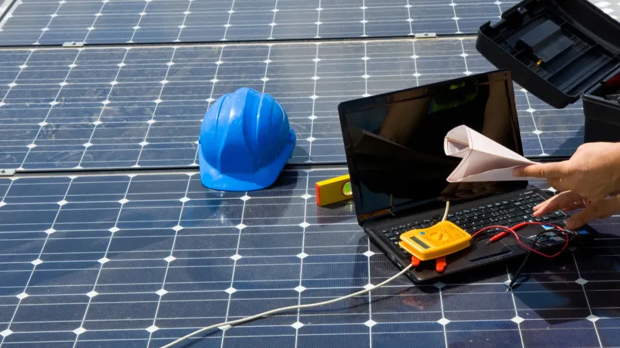 engineer testing solar panels