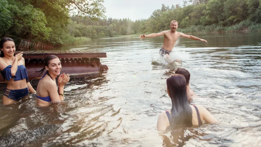 enjoying river party with friends group of beautiful happy young