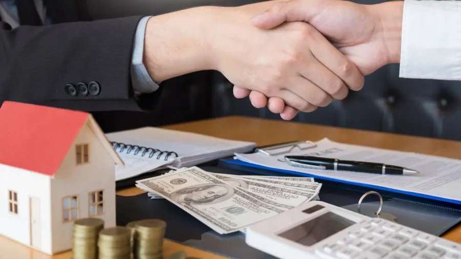 estate agent giving house keys customer sign agreement property for