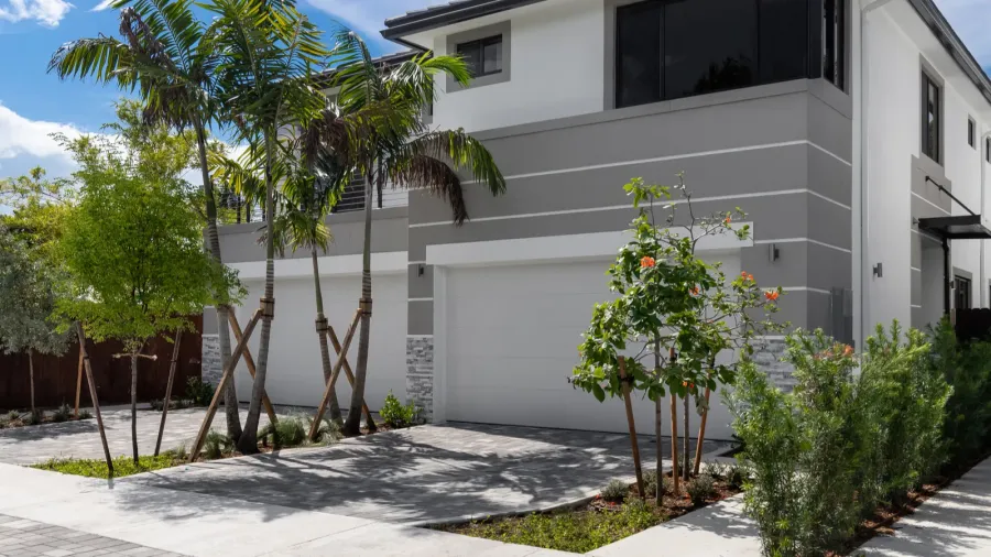 facade of elegant and modern house in white and gray