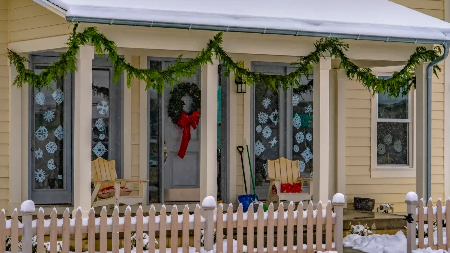 facade of home with christmas decoration in winter