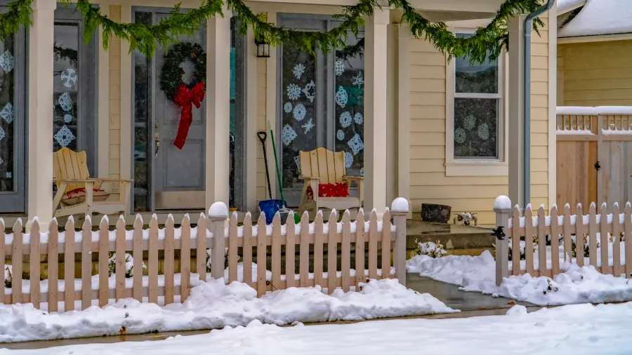 facade of home with christmas decoration in winter