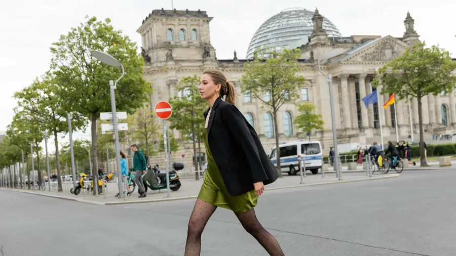 full length of young and fair haired woman in silk