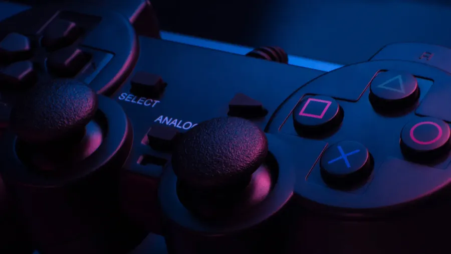 game controller under blue and red lights in a dark