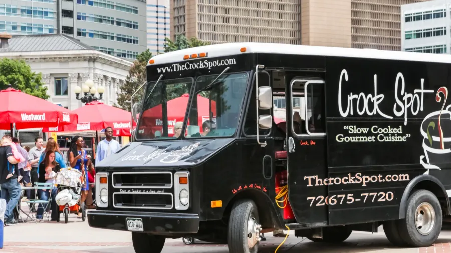 gathering of gourmet food trucks at civic center park