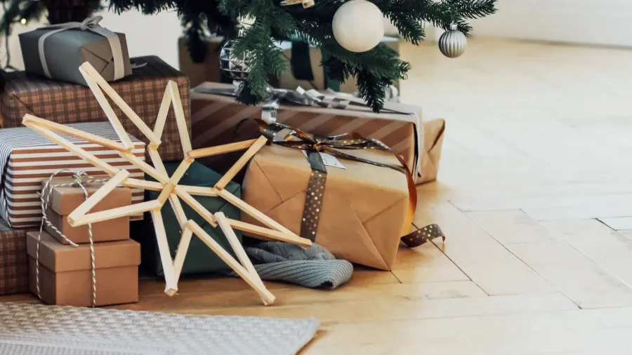gifts under decorated christmas tree minimalistic scandinavian decor background