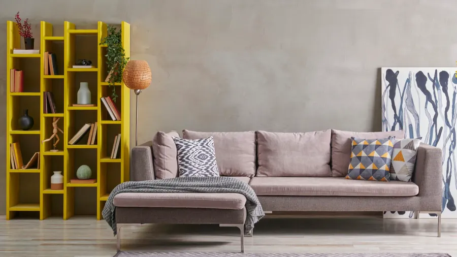 grey stone wall and sofa style with yellow detail niche