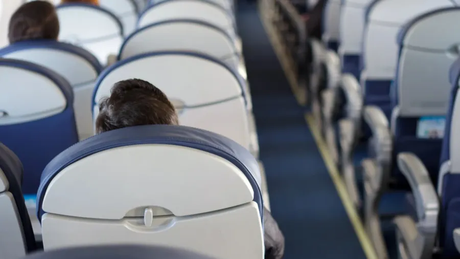 halfempty airplane with few passengers passengers inside the cabin of