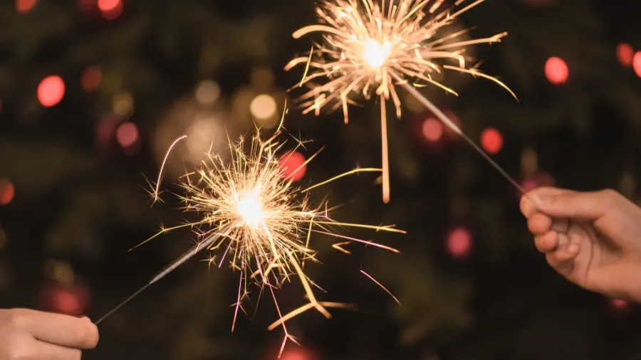 hands holding sparklers