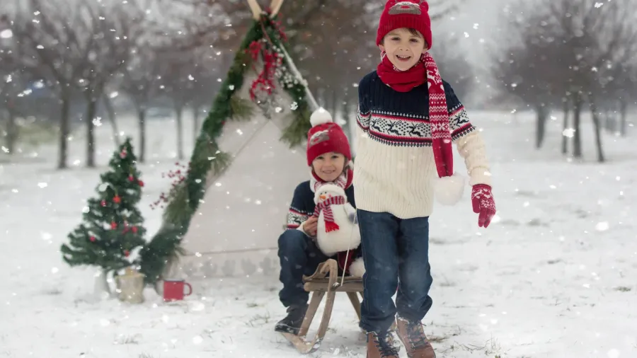 happy family with kids having fun outdoor in the snow