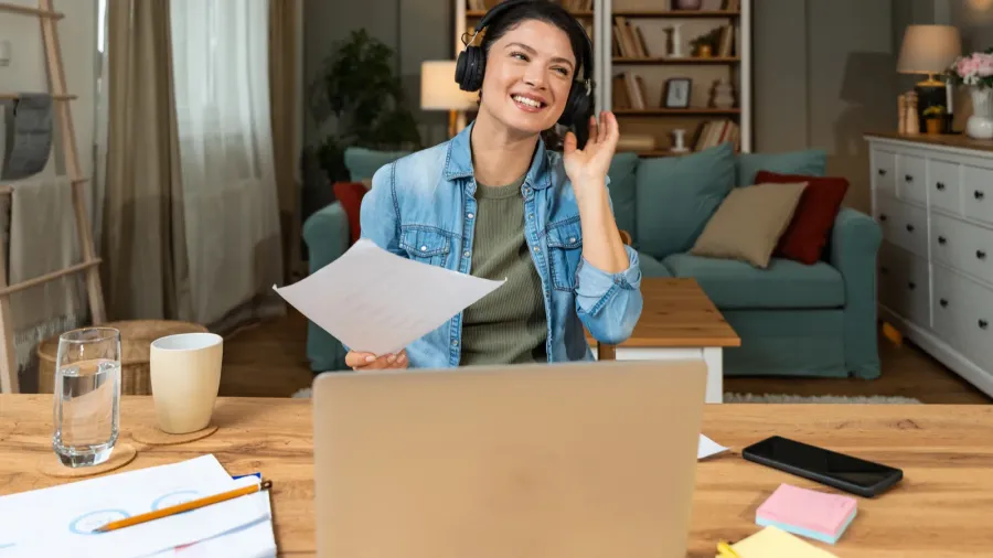 home office young freelance business woman working on laptop wearing