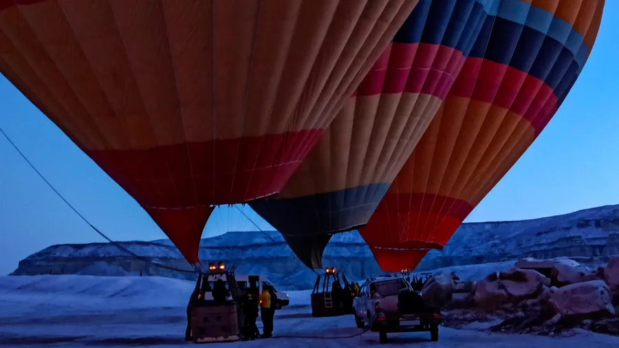 hot air balloons preparing to fly at early morning in