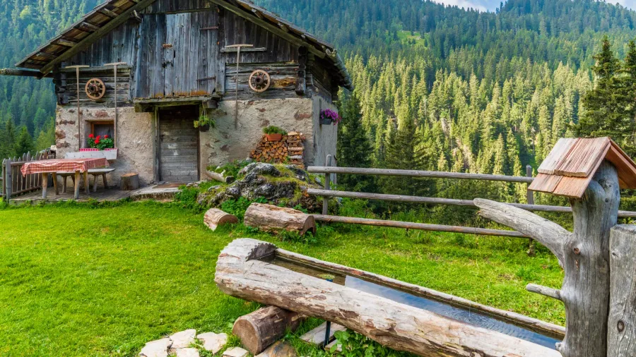 idyllic summer landscape in mountains village wooden house santa maddalena