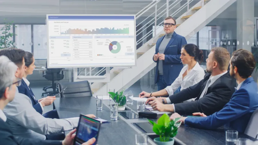 in corporate meeting room creative director uses digital interactive whiteboard