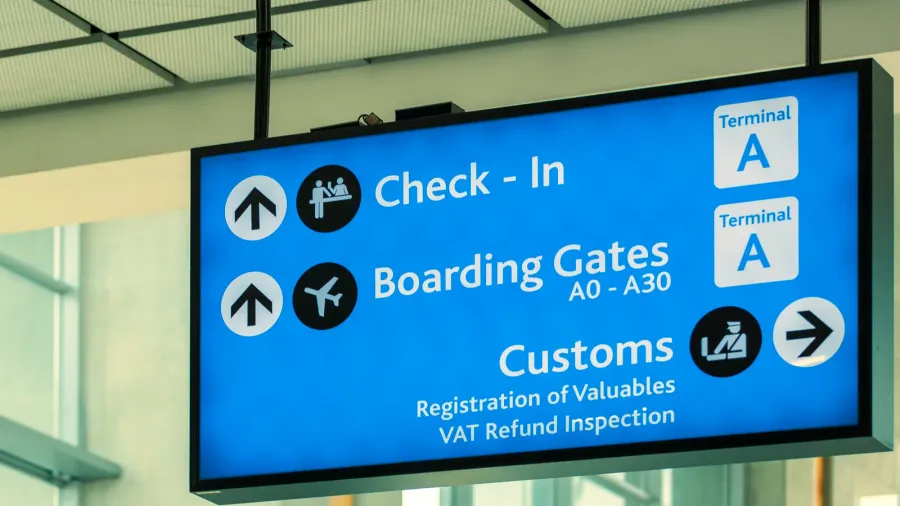 info sign at international airport  directions for check in