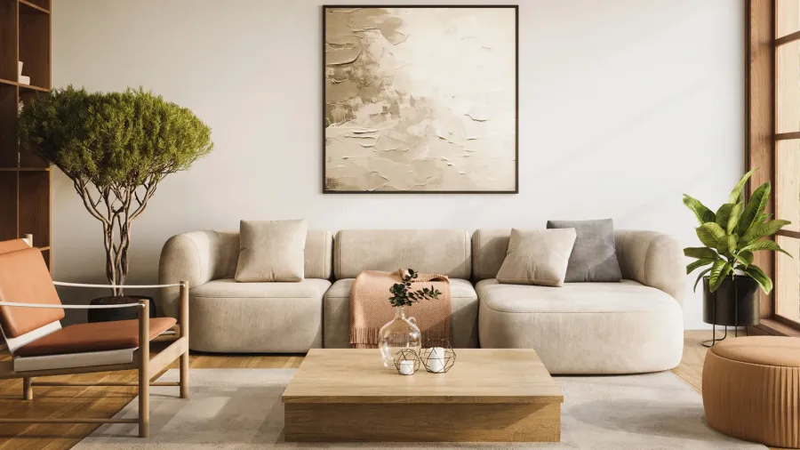A neutral living room interior with beige sofa, leather armchair, coffee table, potted plants, and large abstract artwork hanging on the wall.