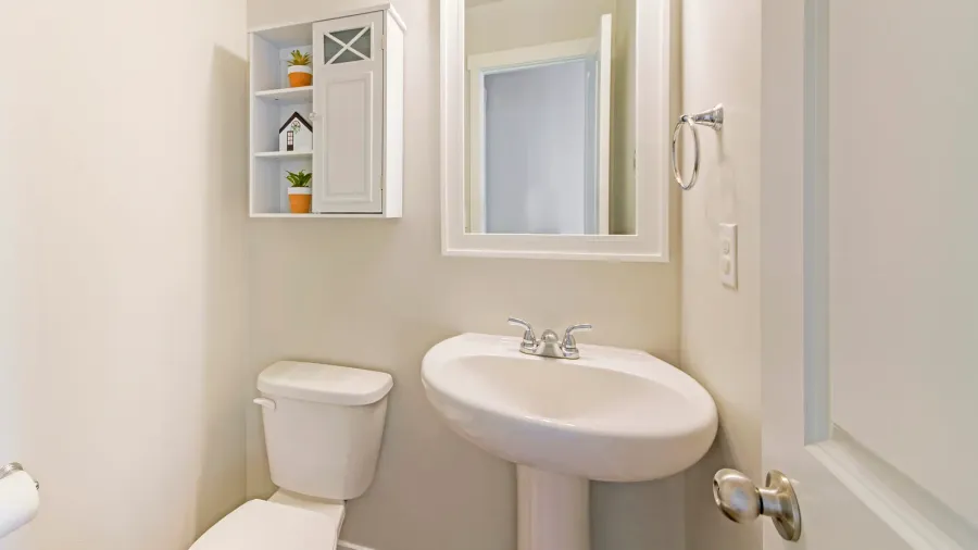 interior of a white powder room with minimalist design
