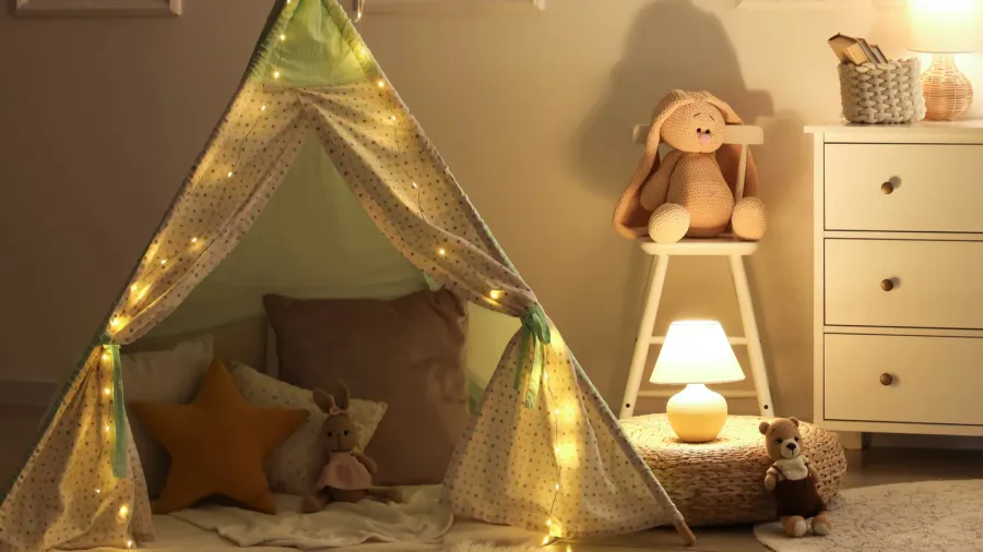interior of childrens room with drawers play tent and glowing