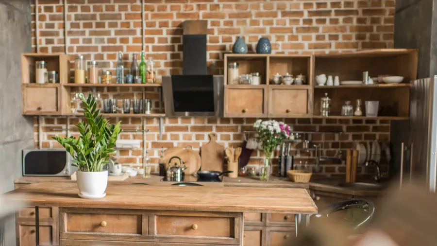 Interior of kitchen with brick wall in loft style.