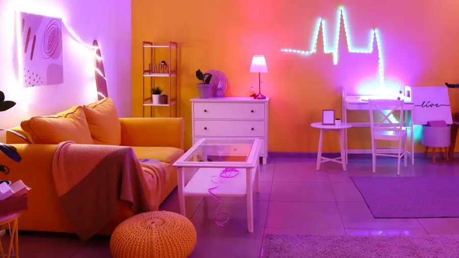 A modern living room interior with sofa, floor cushion, coffee table, and neon lighting.