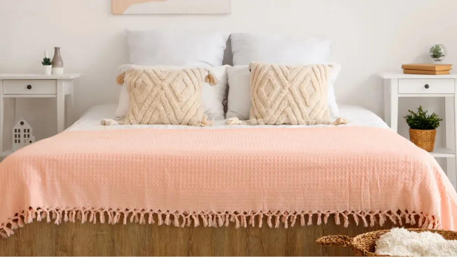 interior of stylish bedroom with picture bedside table and comfortable