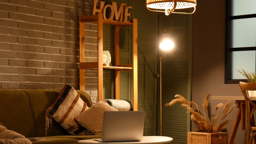 interior of stylish living room at night with sofa and