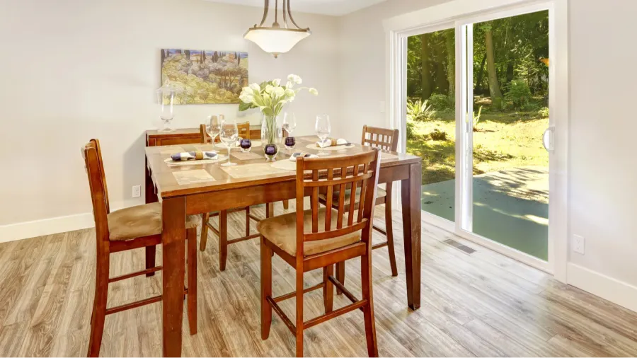 ivory dining room with walkout patio