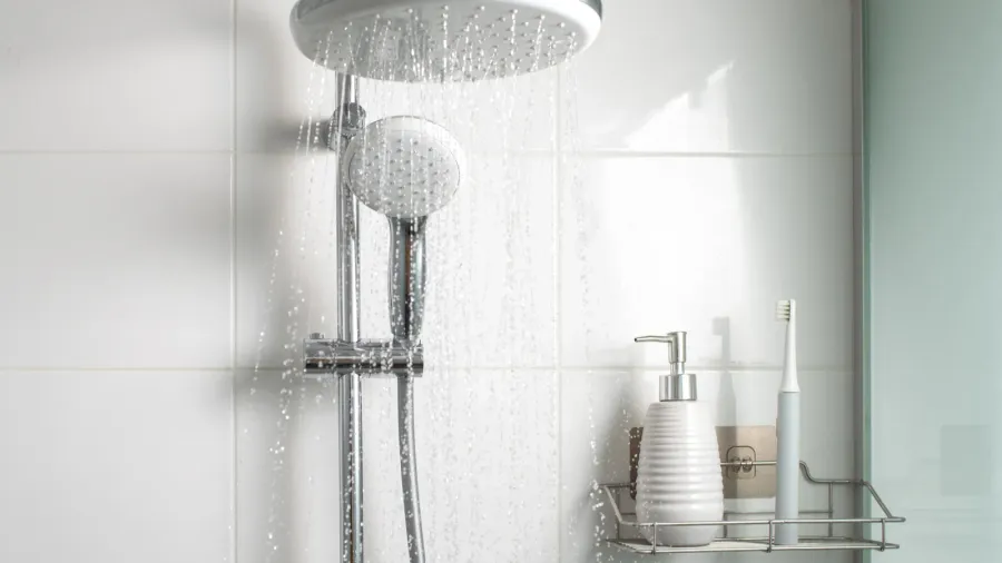 jets of clean water flowing in the shower cabin selective