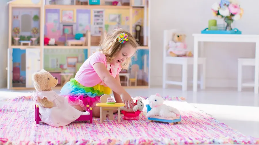 kids playing with stuffed animals and doll house
