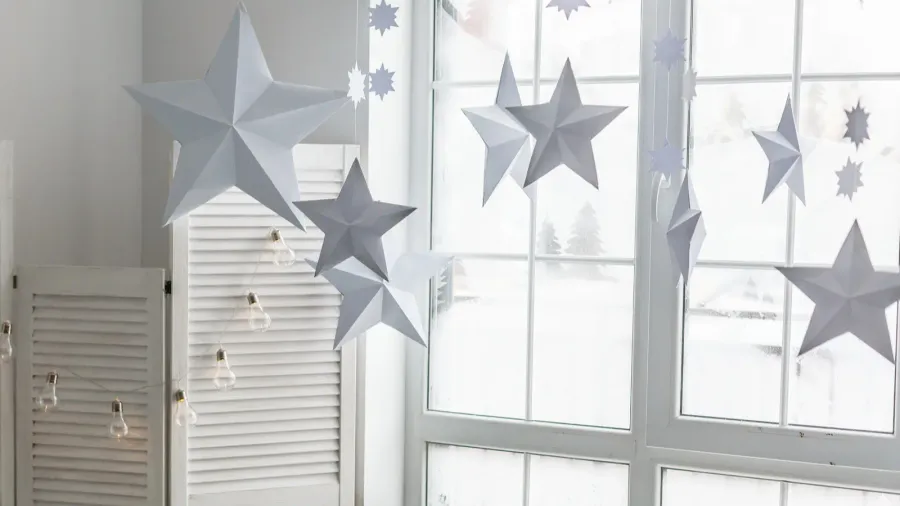 large bright window on the windowsill is a gray knitted