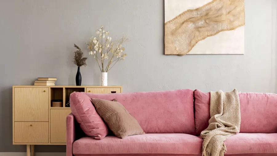 living room in neutral colors with accents of pink and