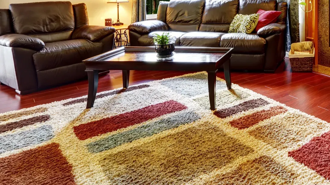 living room interior with leather couches and fireplace
