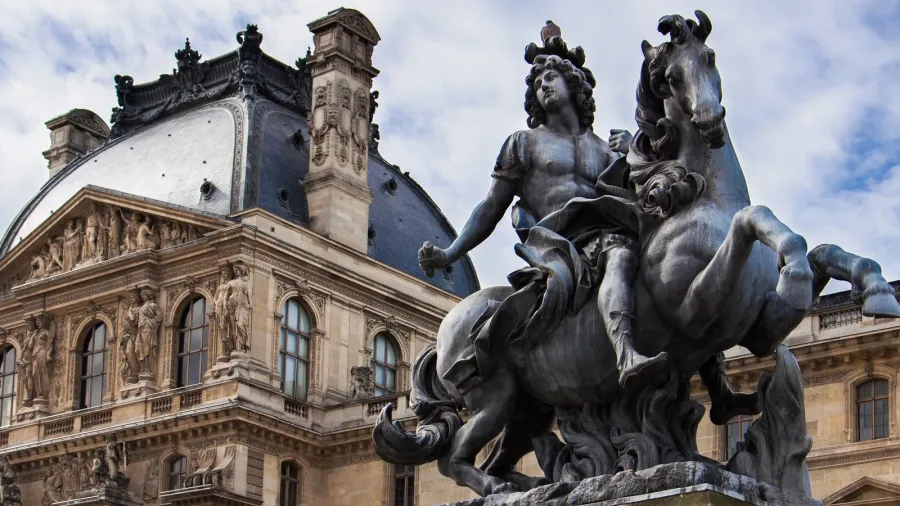 louis xiv statue at louvre museum courtyard paris france