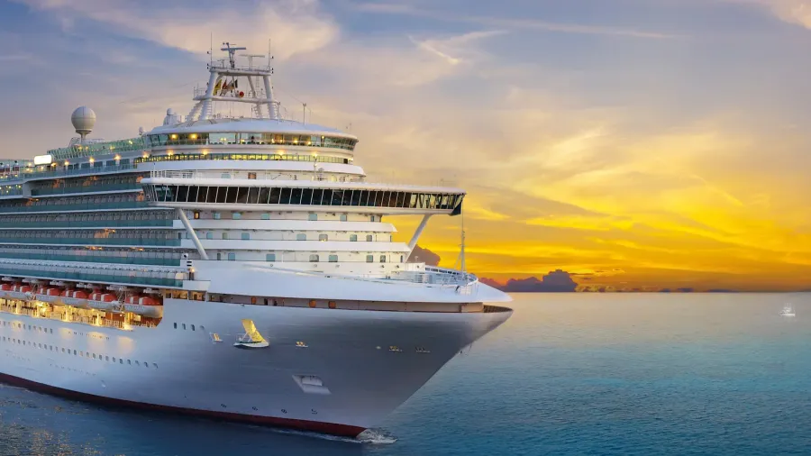luxury cruise ship sailing to port on sunrise