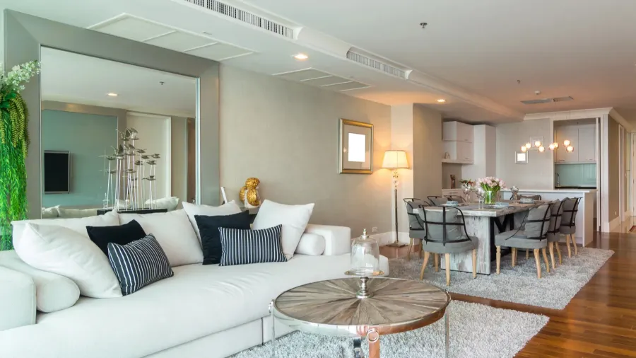 Luxury interior of living room with a big wall mirror.