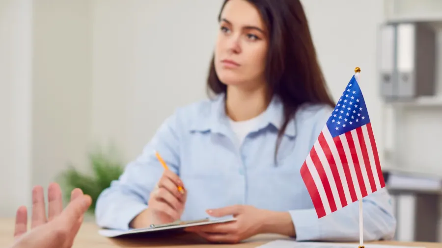 male person sitting in the office of the us public